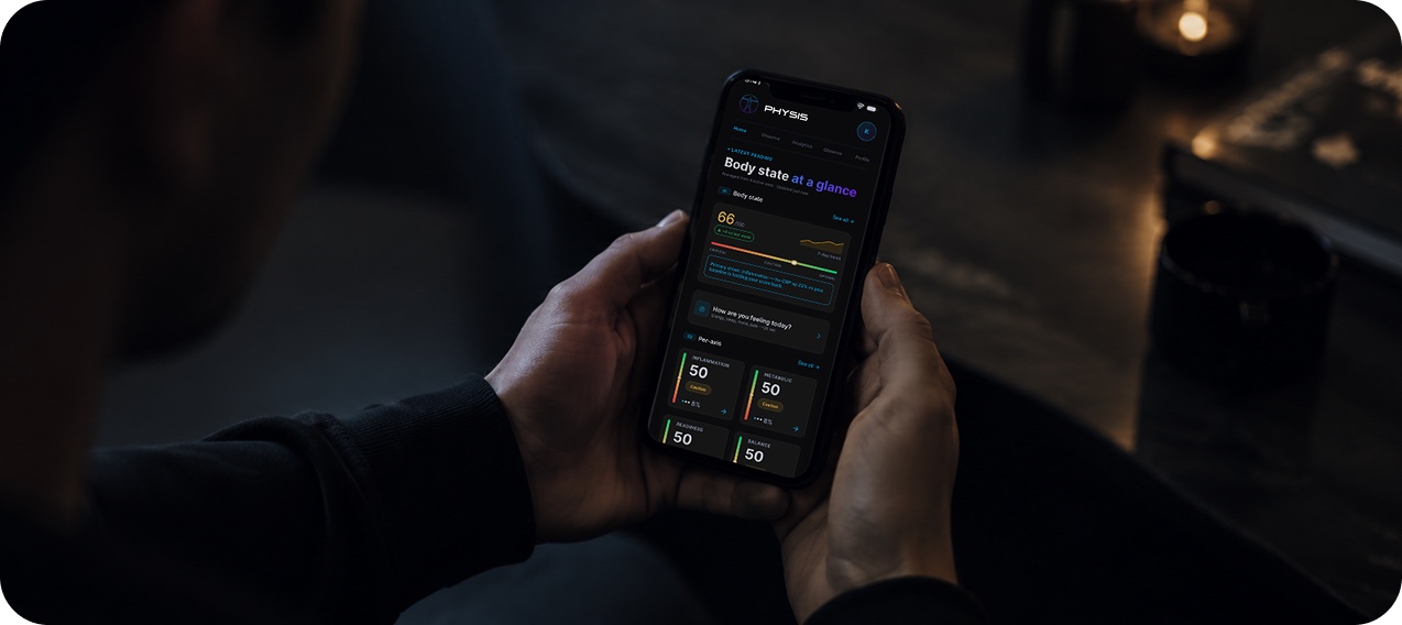 PHYSIS app showing Body State at a glance, held in hand